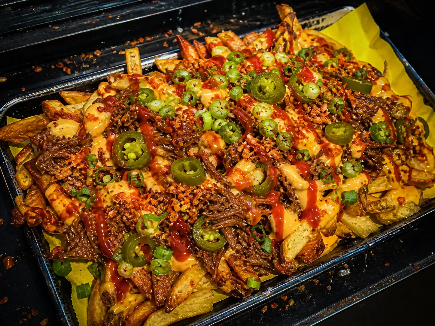 Loaded fries with pulled beef, jalapenos, cheese sauce and chilli crumbs